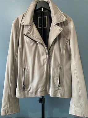 Women’s taupe leather jacket with detail